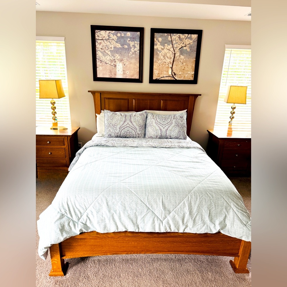 Elegant queen reversible print comforter and two queen pillow shams.